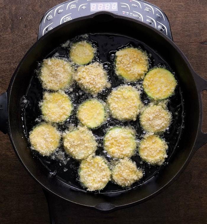Frying the zucchini.
