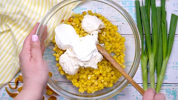 Sour cream and mayonnaise added to corn mixture.