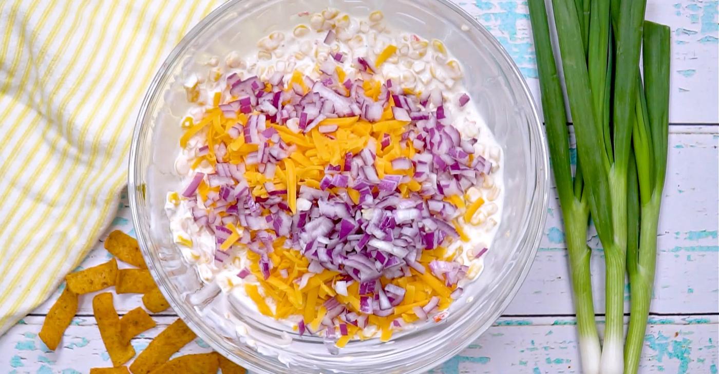 Onion and cheese being added.
