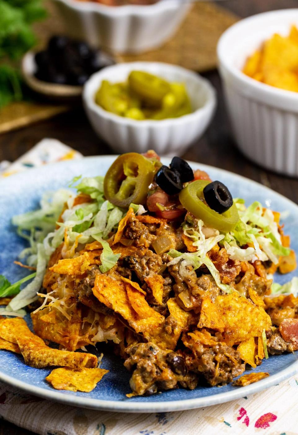 Ground Beef Doritos Casserole dished up on a plate.