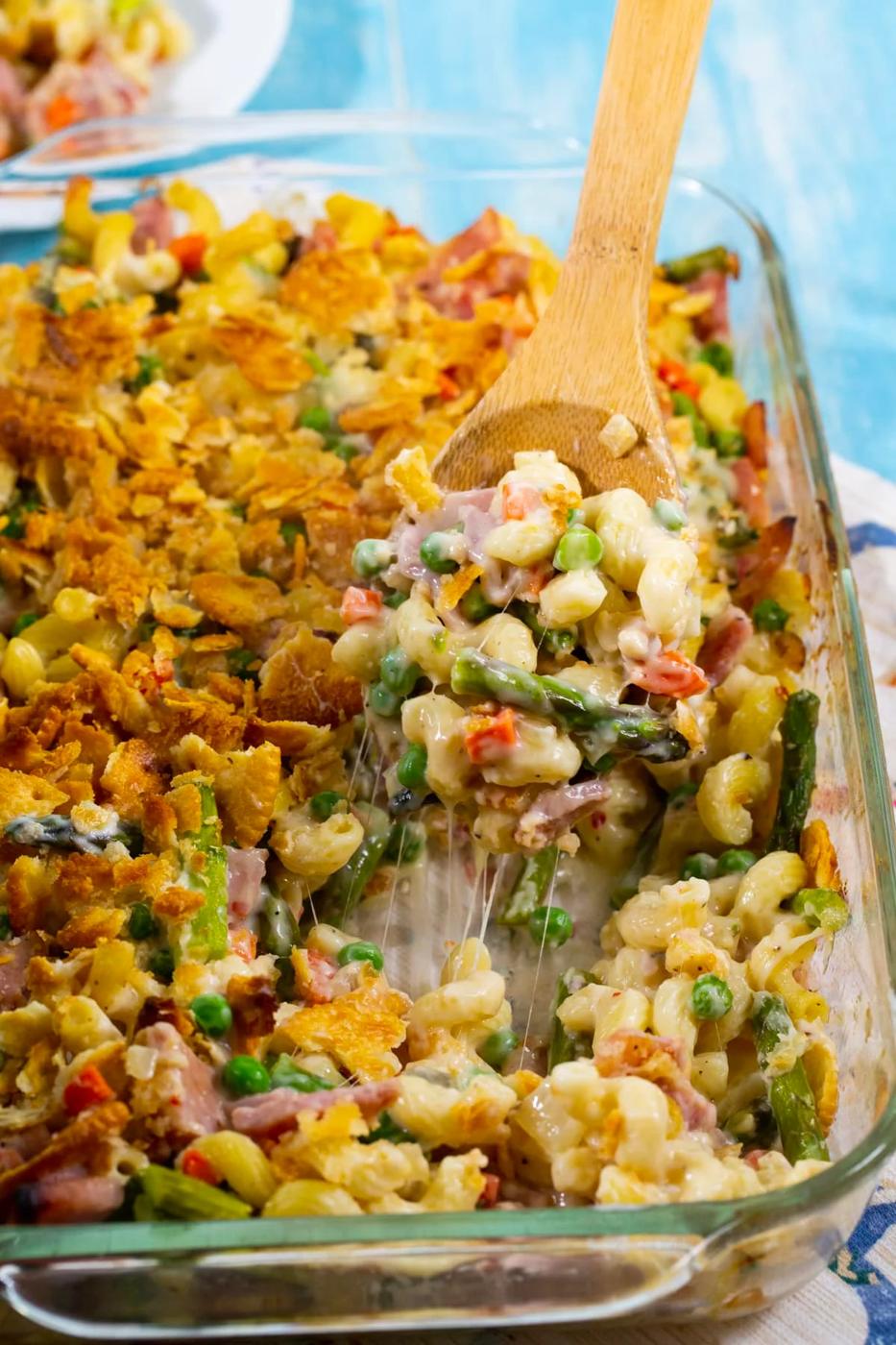 Spoon scooping up casserole.
