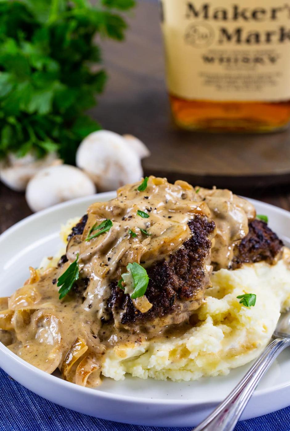 Hamburger Steaks with Bourbon Mushroom Gravy over mashed potatoes.