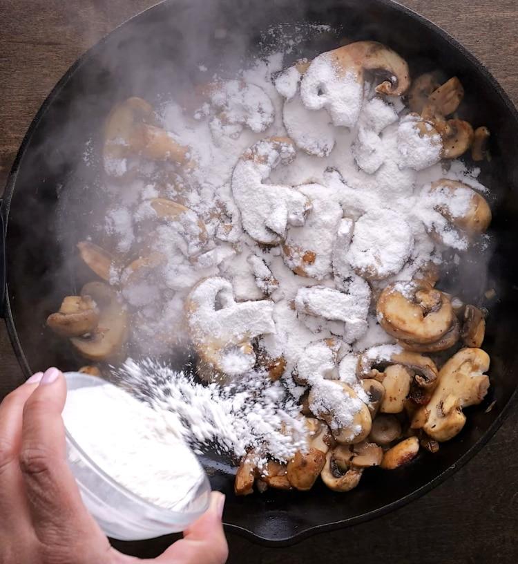 Adding flour to pan.