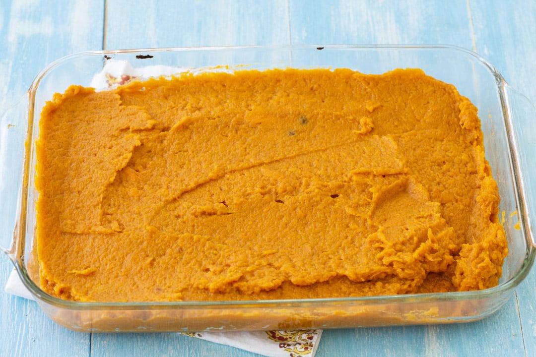 Sweet potato mixture spread in baking dish.