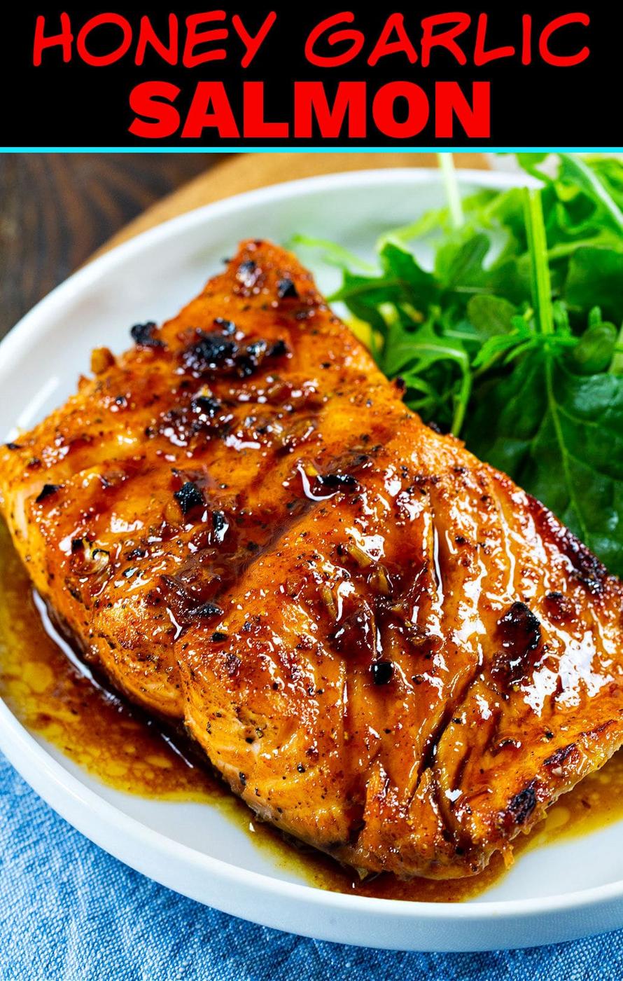 Honey Garlic Salmon on plate with green salad.