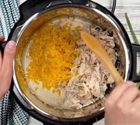 Adding chicken and cheese.