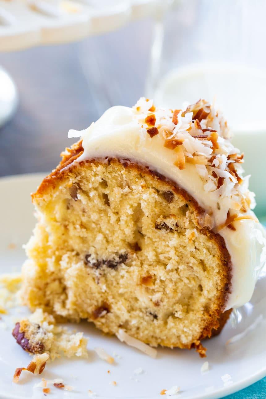 Slice of Italian Cream Bundt Cake on a plate.