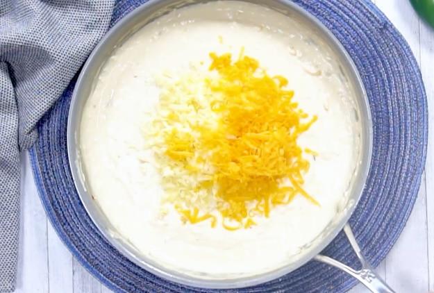 Adding half the cheese.