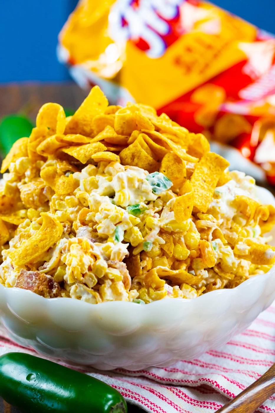 Corn Salad topped with Fritos in a bwol.