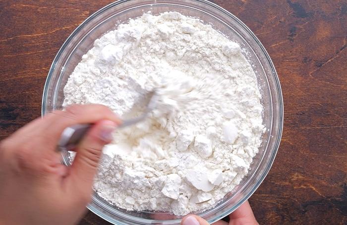 Mixing together dry ingredients.
