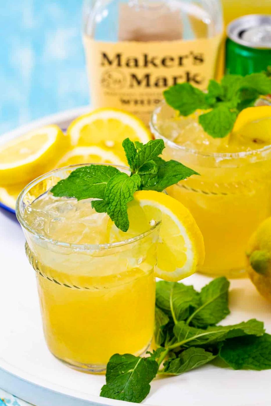 Two Lemonades with bourbon a a tray.