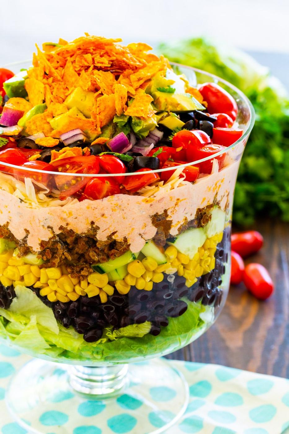 Layered Taco Salad in a trifle bowl.