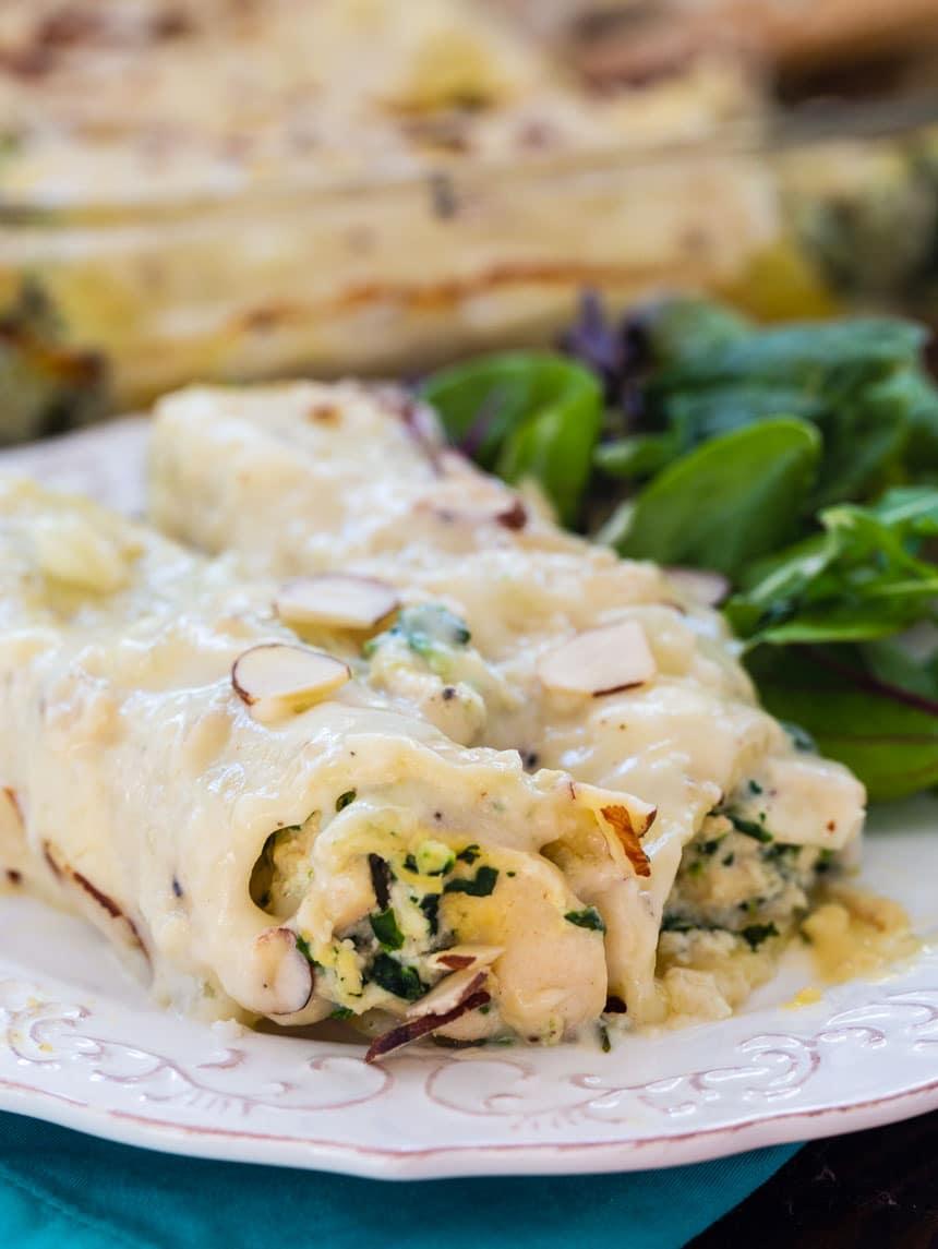 Creamy Chicken Manicotti on a plate with green salad