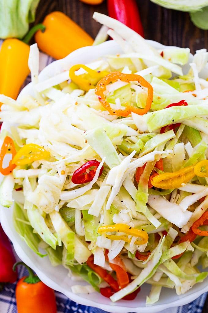 Marinated Cabbage Slaw with red, orange, and yellow sweet peppers.
