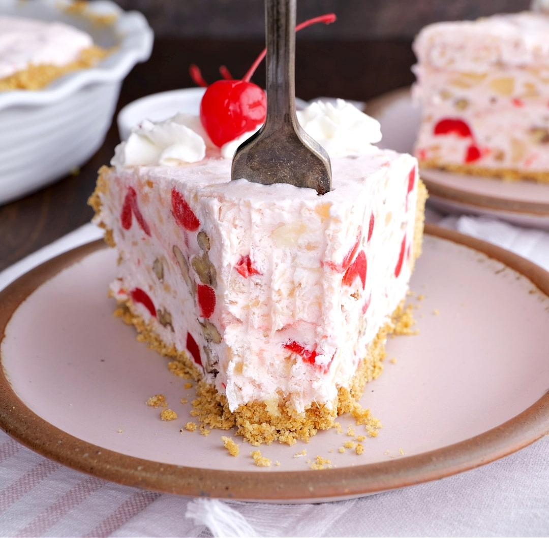 Fork going into a slice of pie.