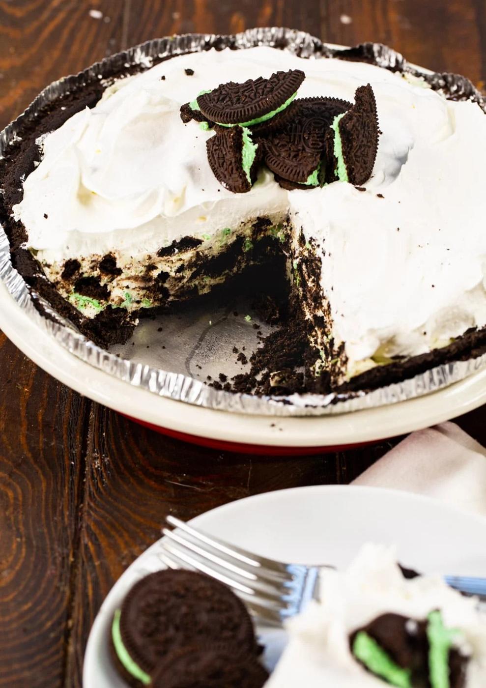 Mint Oreo Pie with a slice cut out.