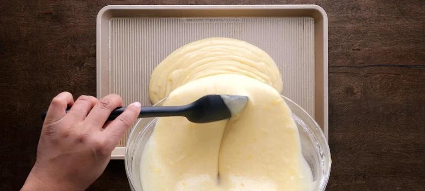 Pouring the batter into sheet pan.