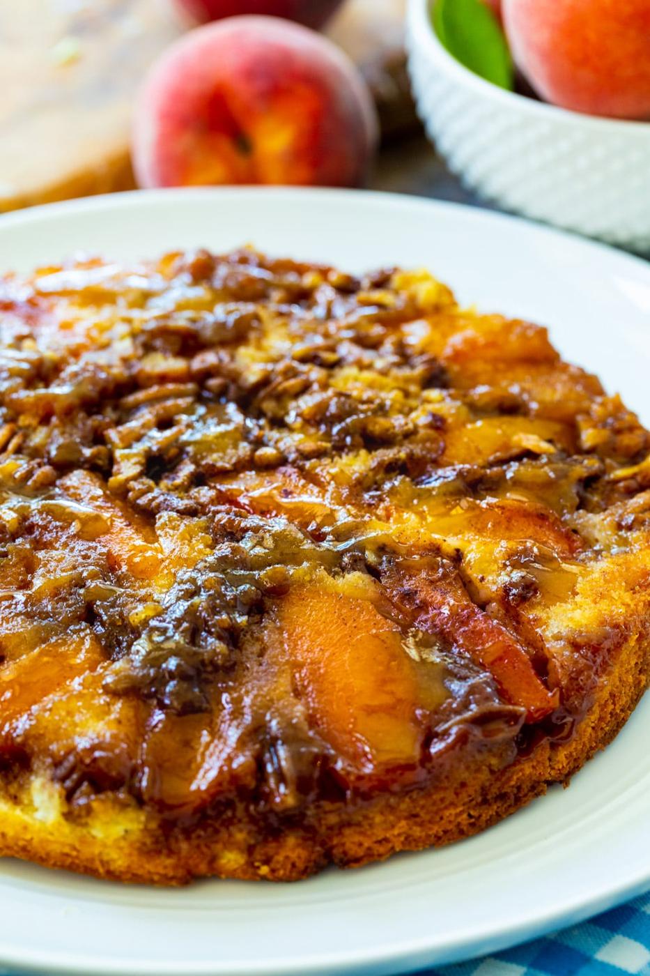 Whole Peach Upside Down Cake on a plate.