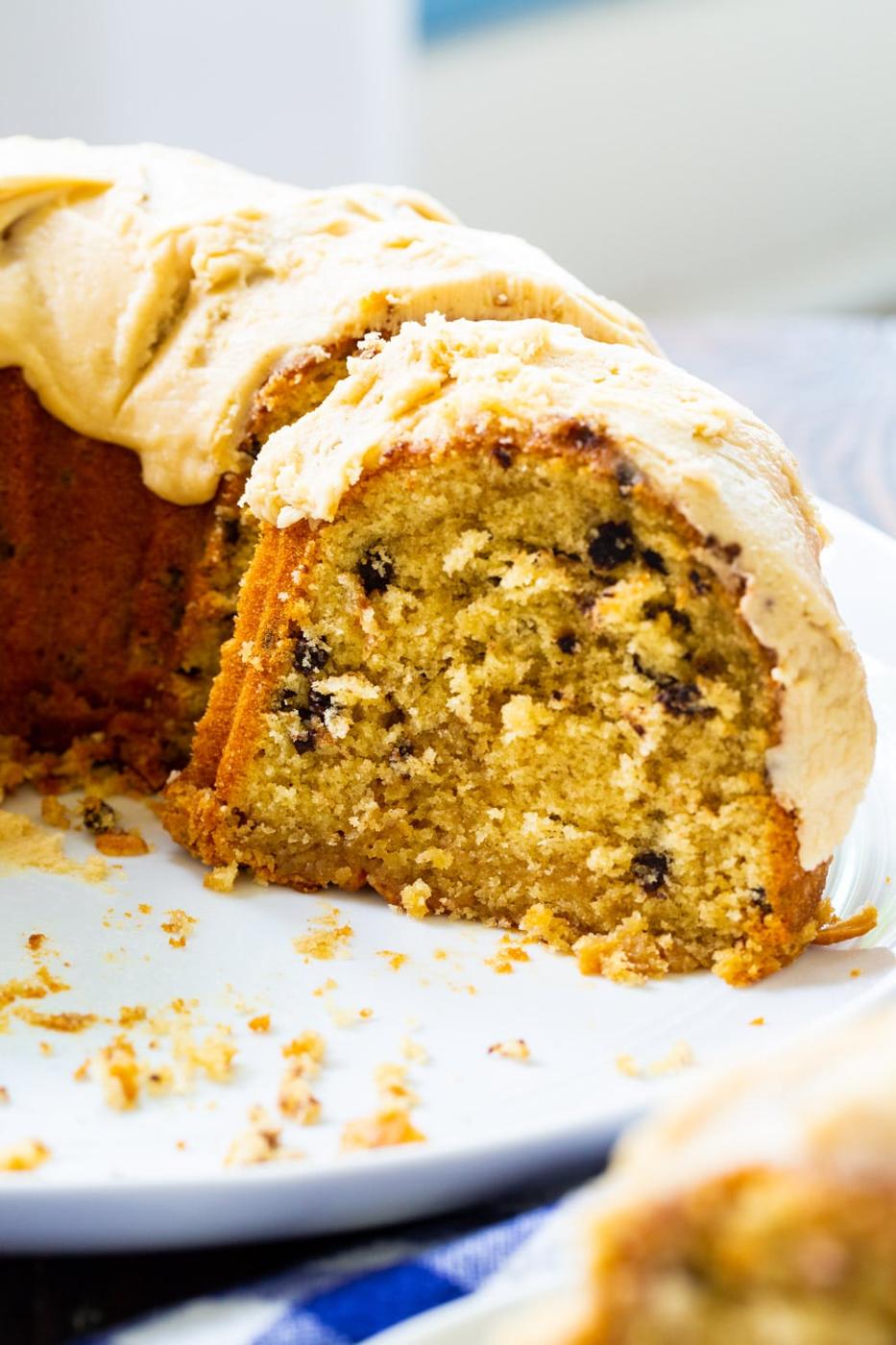 Half of Bundt Cake on a serving platter.