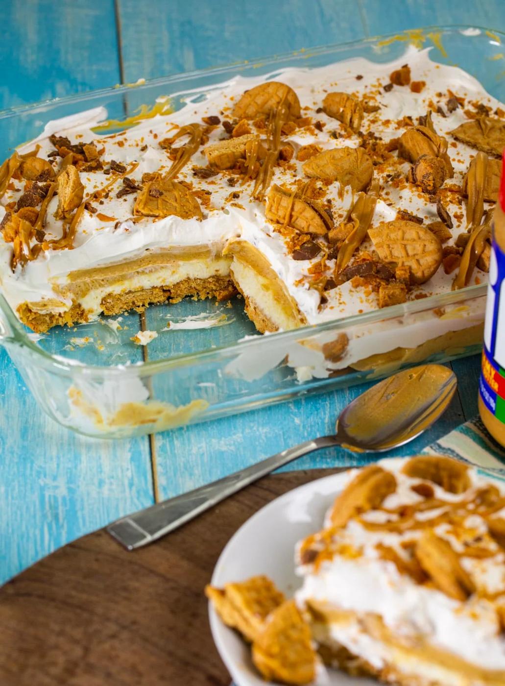 Peanut Butter Lasagna in pan with a piece cut away.