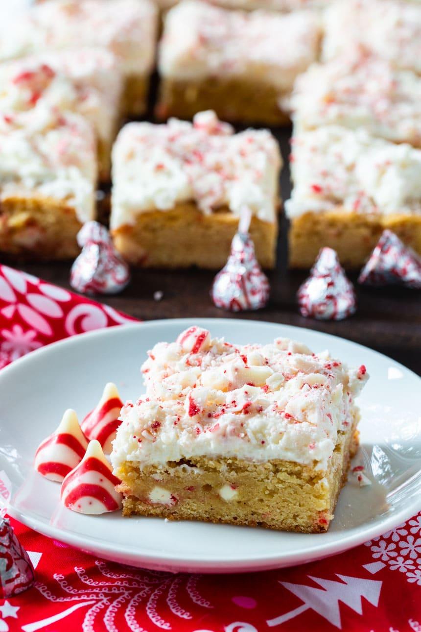 Peppermint Blondie on a plate with more blondies in background.