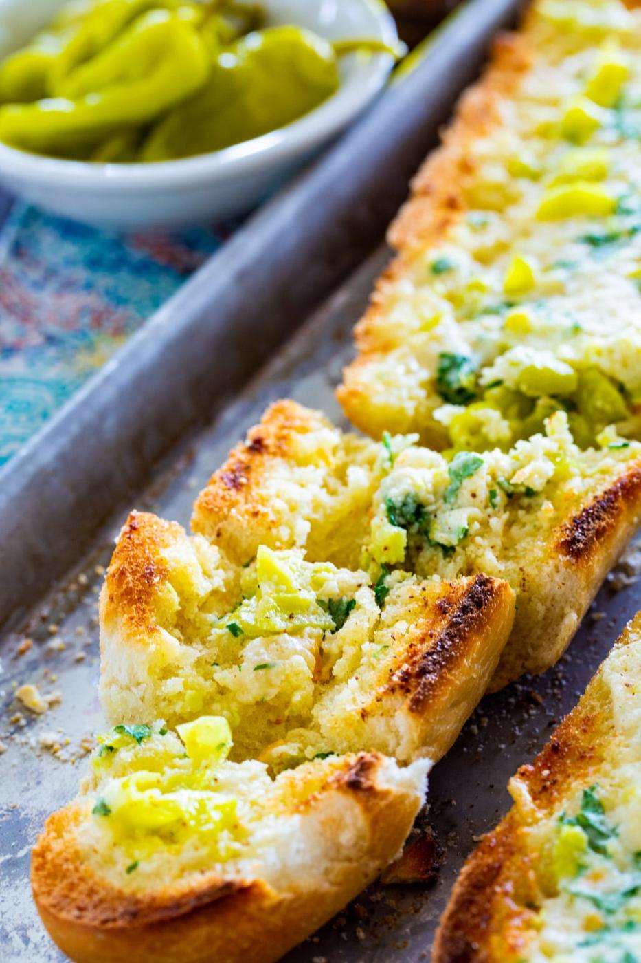 Loaf of Pepperoncini Garlic Bread cut into slices.