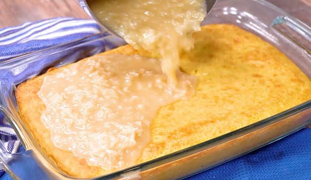 Pouring frosting onto cake.
