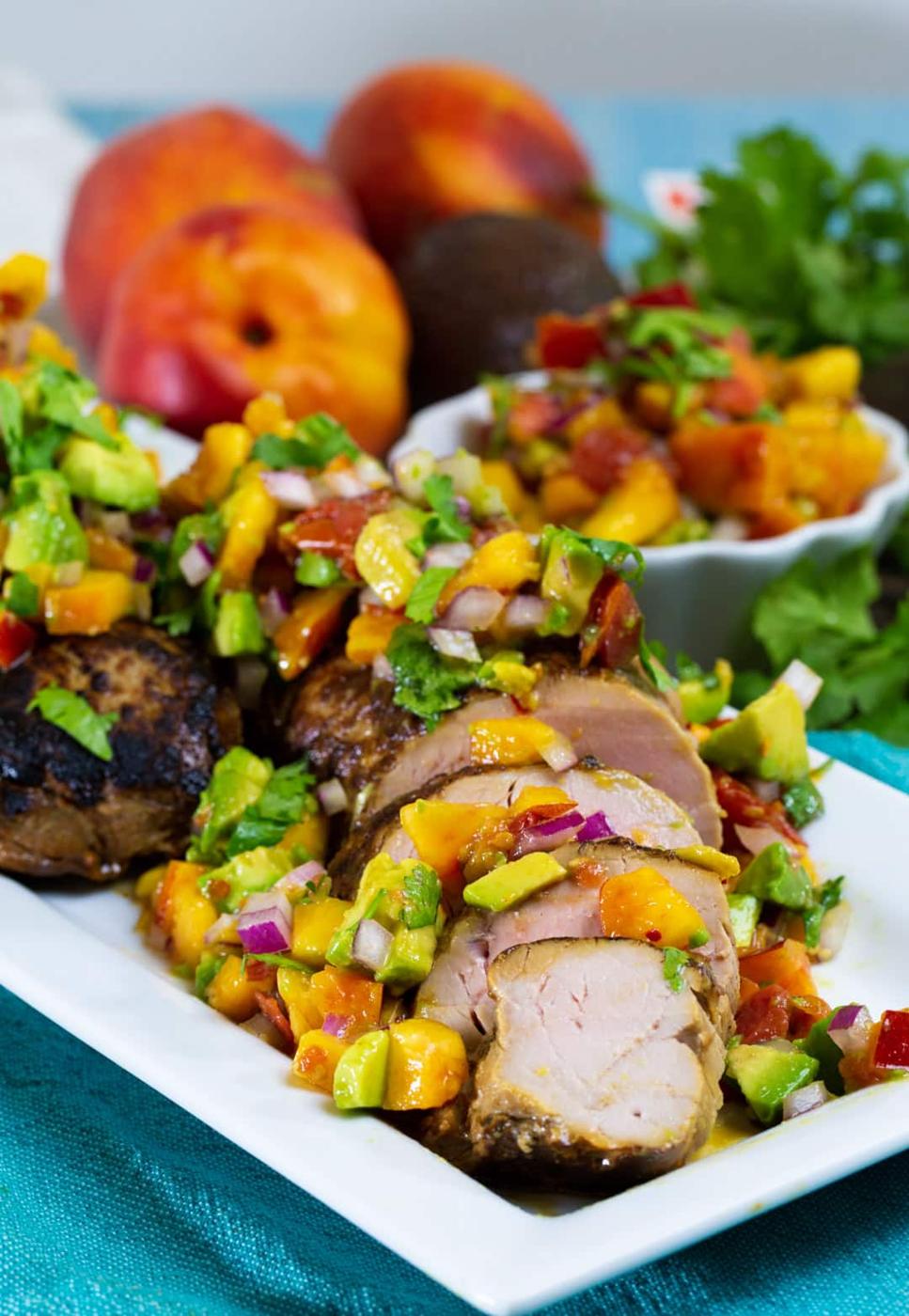 Sliced Pork Tenderloin covered with salsa.