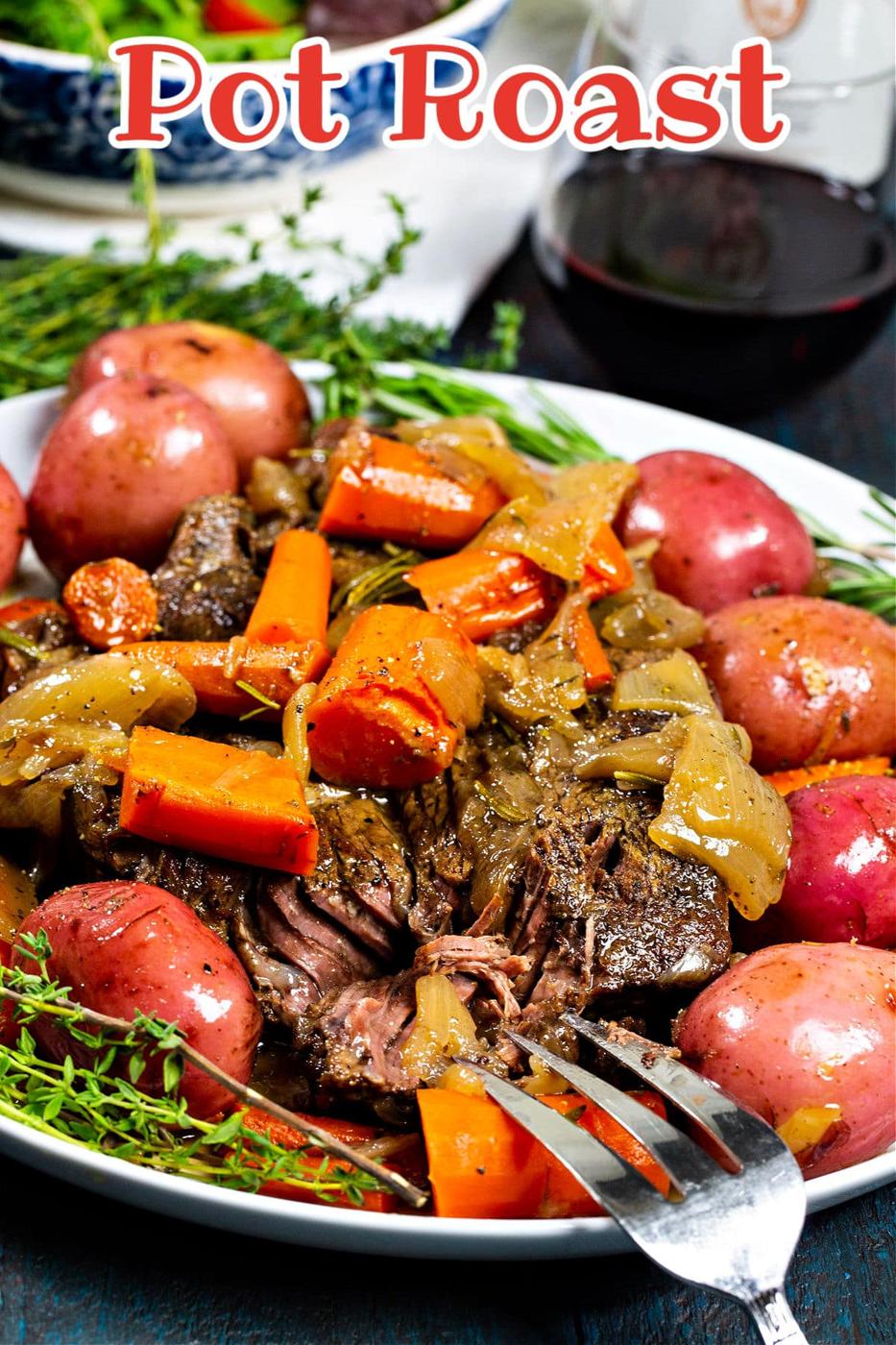 Fork cutting into pot roast.