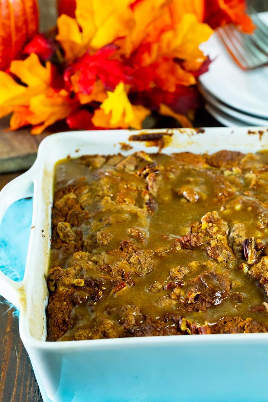 Coffee Cake topped with glaze in baking dish.