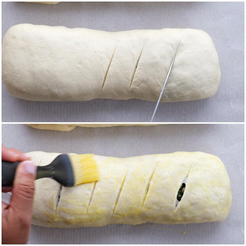 Cutting slits in bread and brushing with egg.