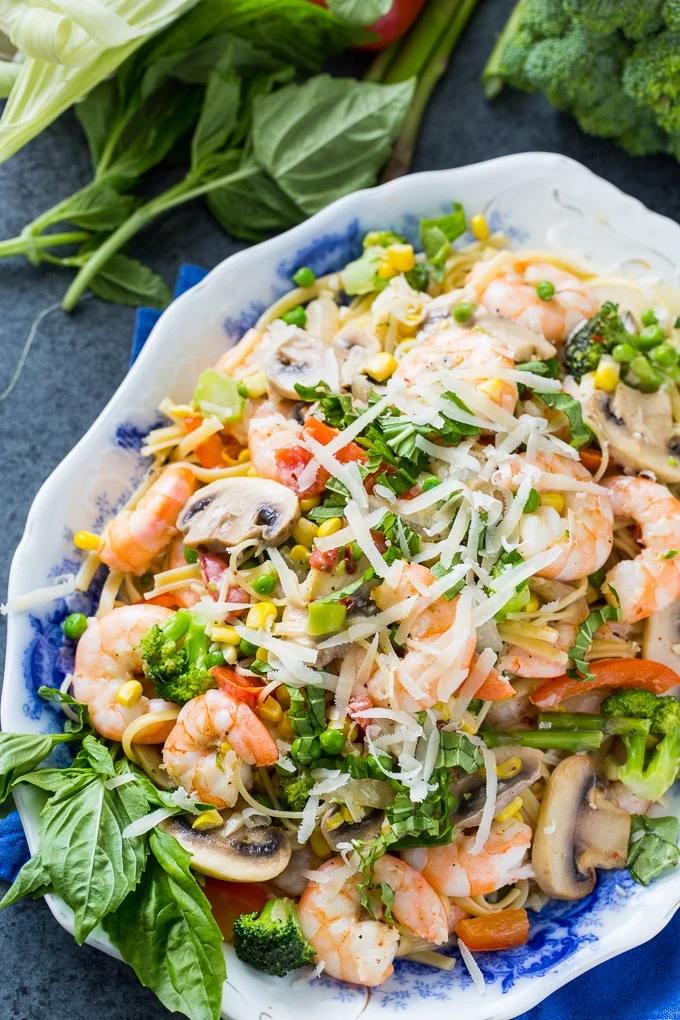 Shrimp Pasta Primavera with lots of fresh vegetables in a creamy sauce.