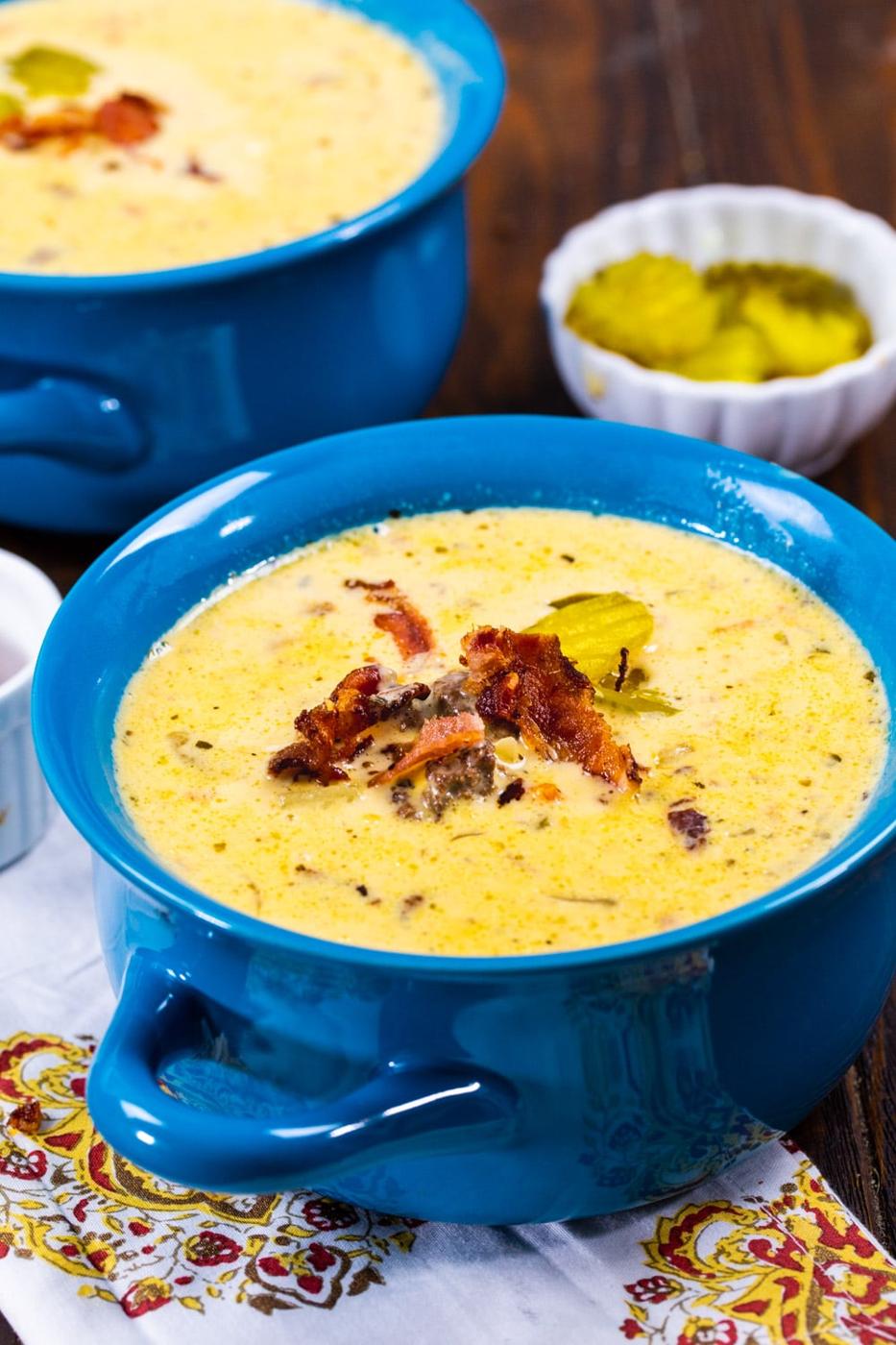 Slow Cooker Bacon Cheeseburger Soup in a blue bowl.