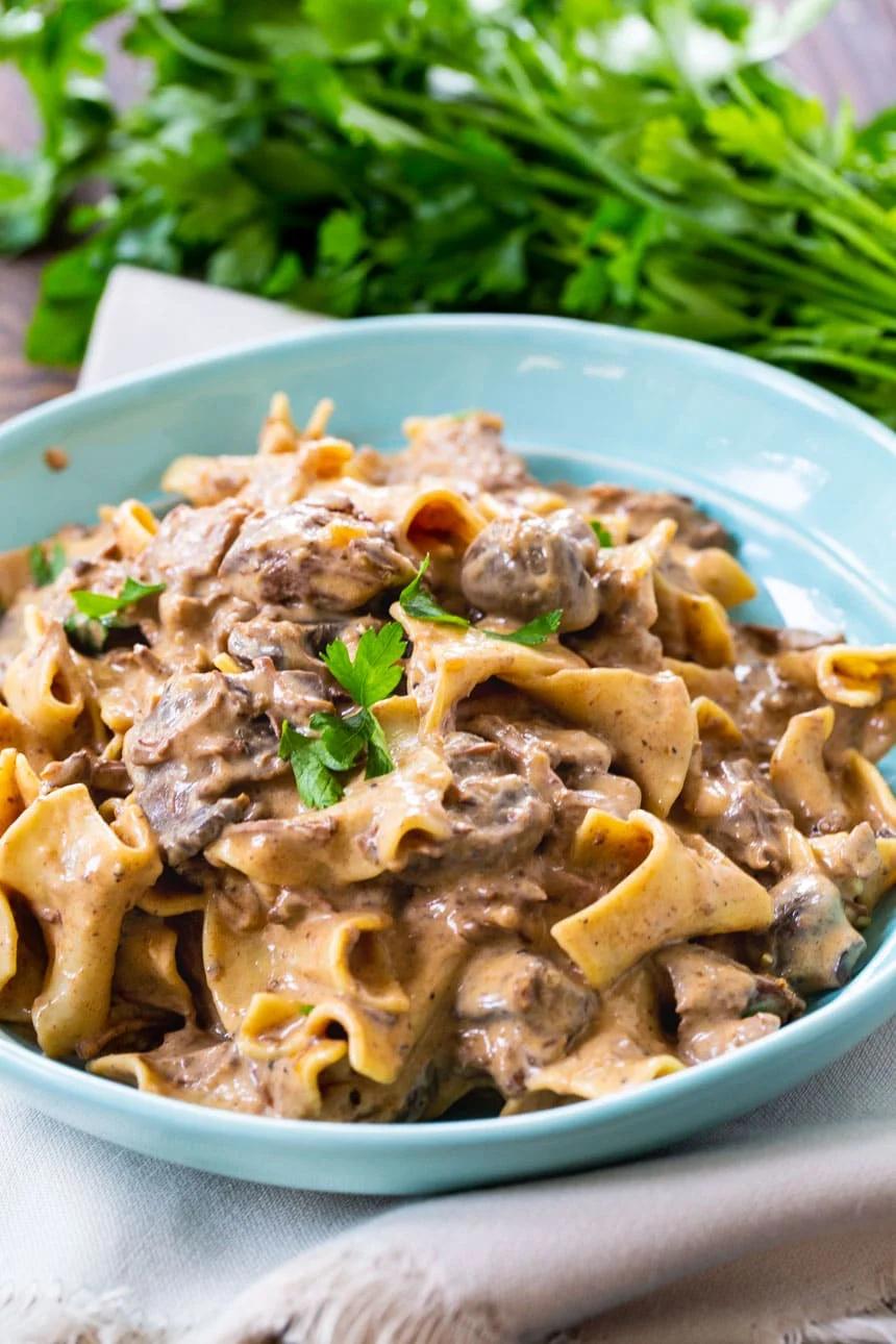 Slow Cooker Beef Stroganoff in a blue bowl.