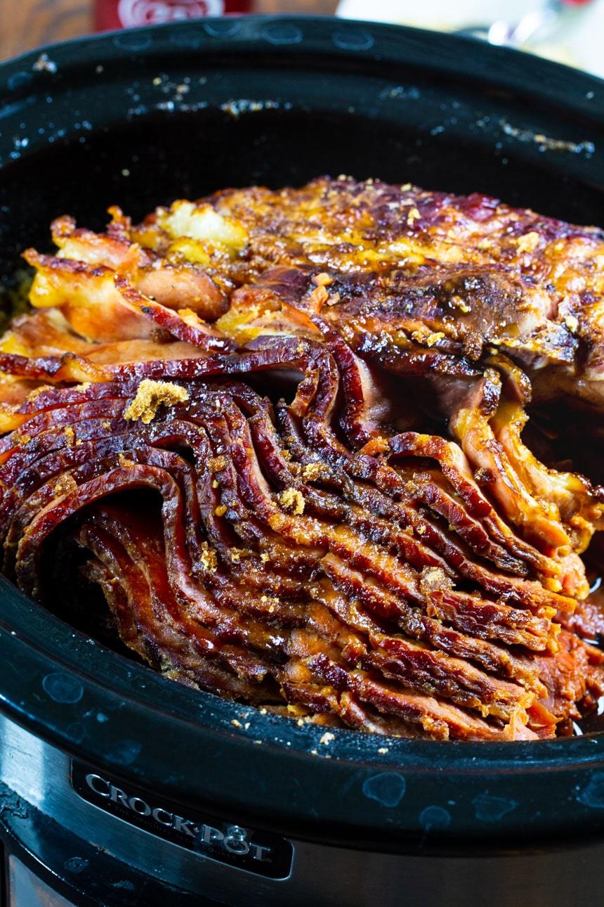 Slow Cooker Brown Sugar and Cola Glazed Ham in a crock pot.
