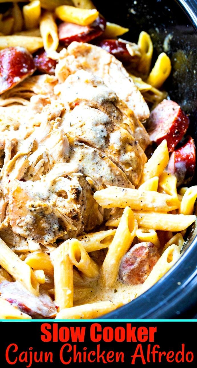 Close-up of chicken alfredo in a black crock pot.
