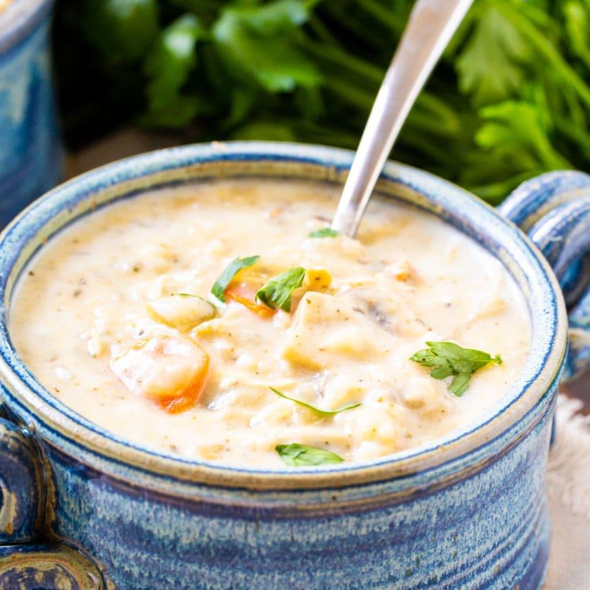 Creamy Chicken Soup in a blue bowl.