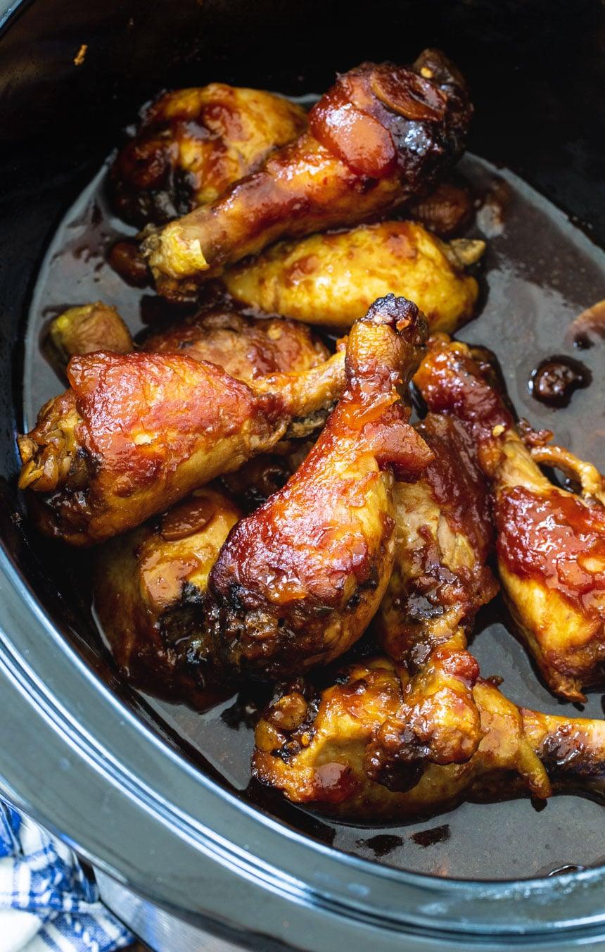 Chicken Legs in a black slow cooker.