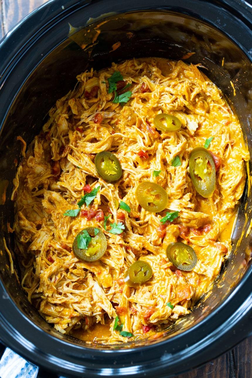 Shredded NAcho Chicken in a black 6-quart slow cooker