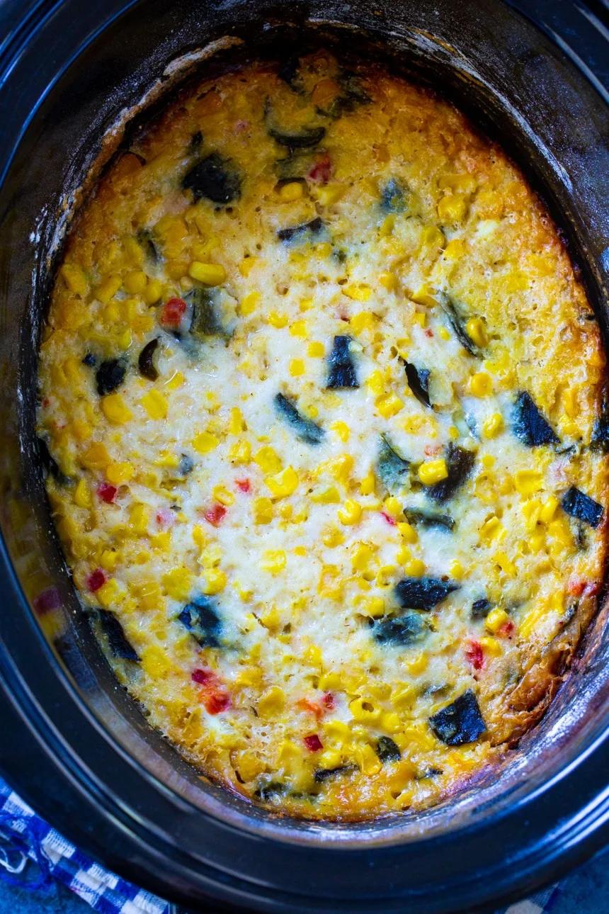 Southwestern Corn Casserole in a black slow cooker.