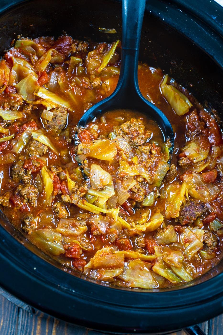 Spoon full of Slow Cooker Spicy Cabbage Beef Soup.