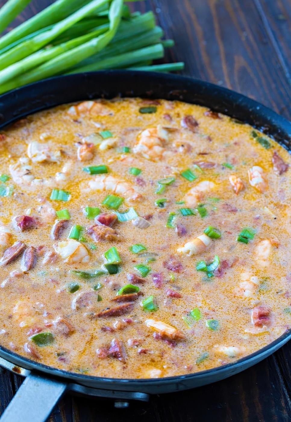 Smothered shrimp sauce in a skillet.