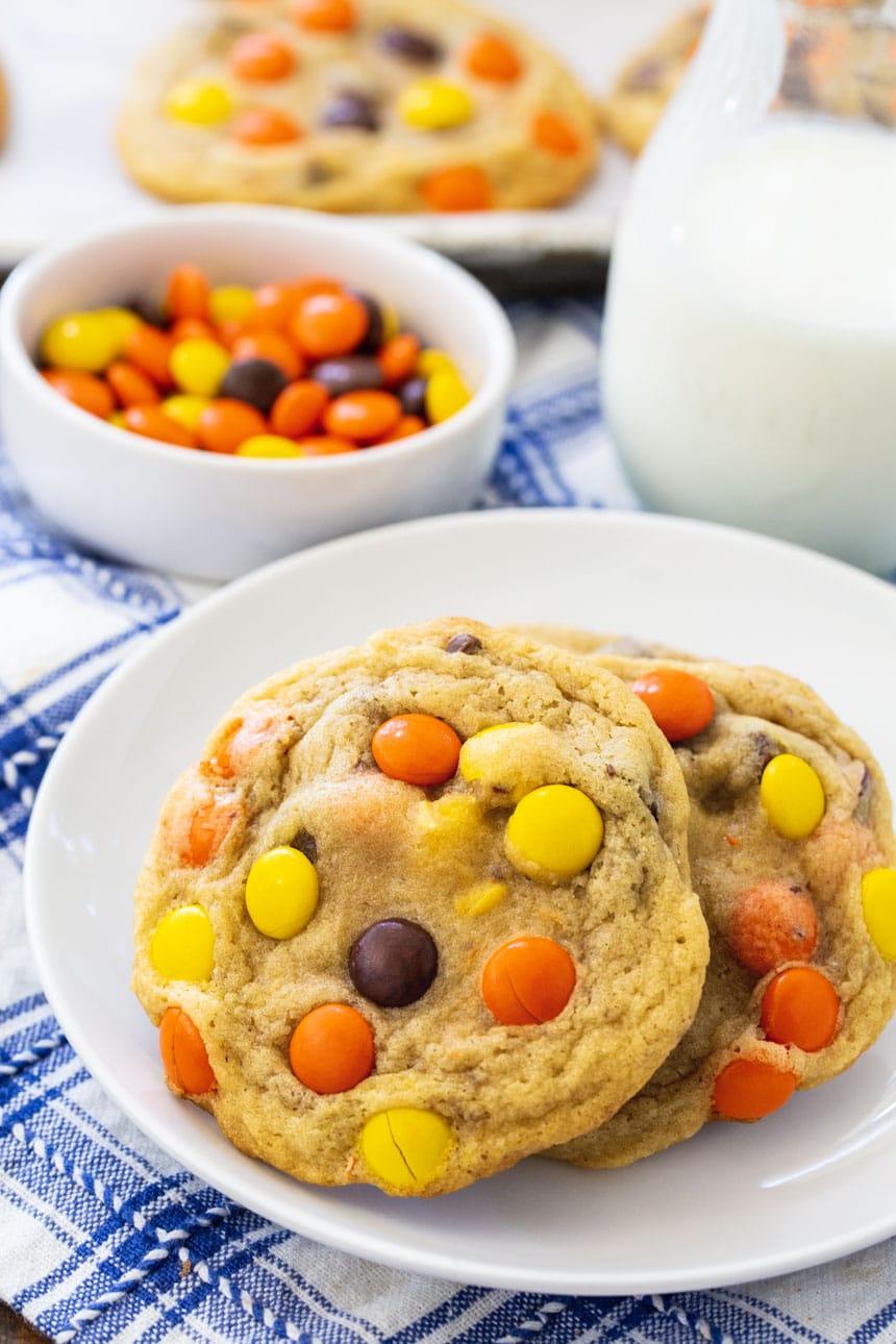 Soft Baked Reese's Pieces Cookies on a small white plate.