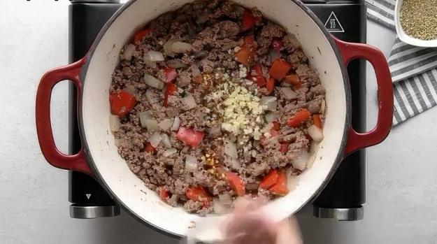 Adding garlic.