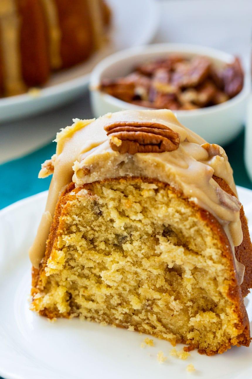 Slice of bundt cake on small white plate.