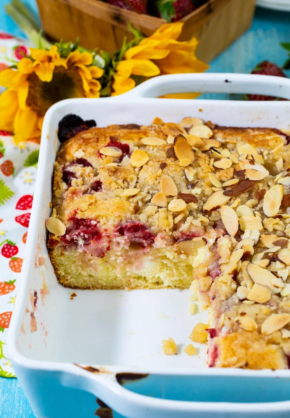 Strawberry Cream Cheese Coffee Cake in baking dish with piece cut away.