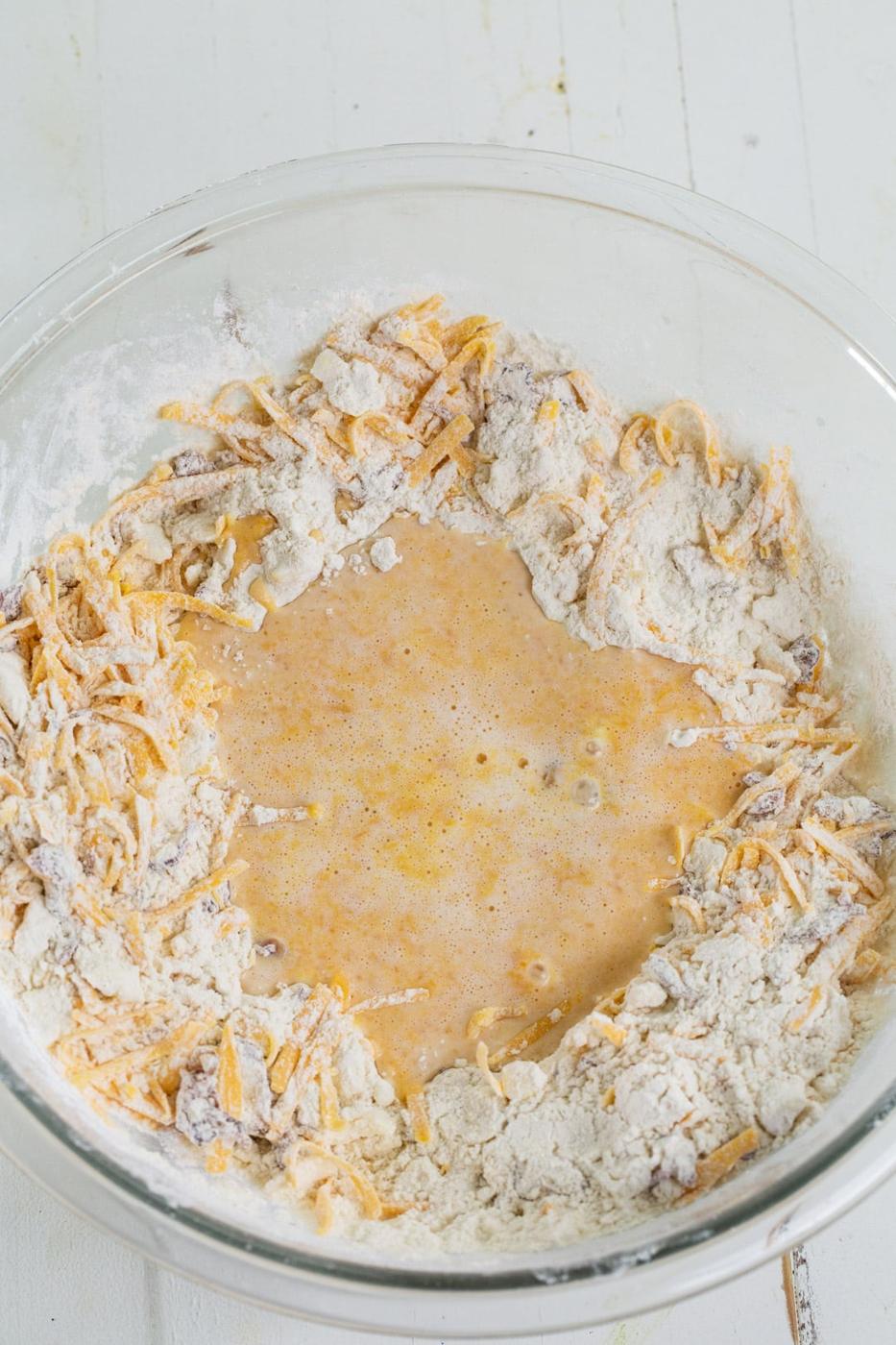 Liquid ingredients added to dry ingredients.