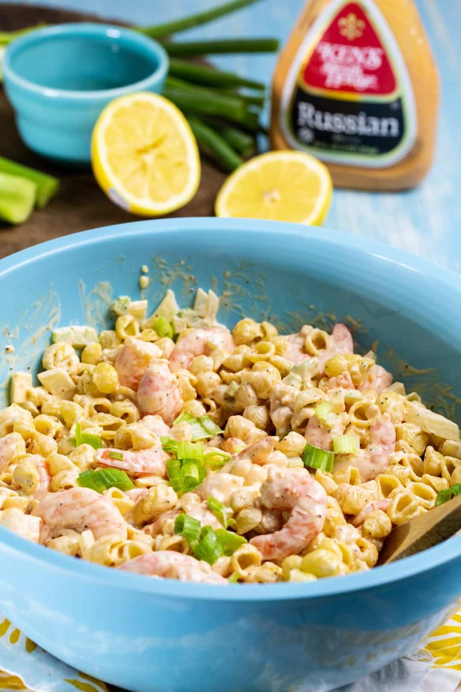 Tangy Shrimp Pasta Salad in blue mixing bowl.