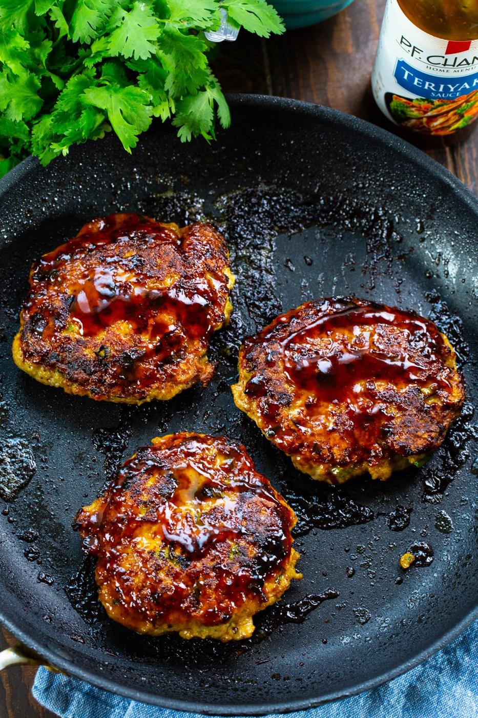 Teriyaki Chicken Burgers in a skillet.