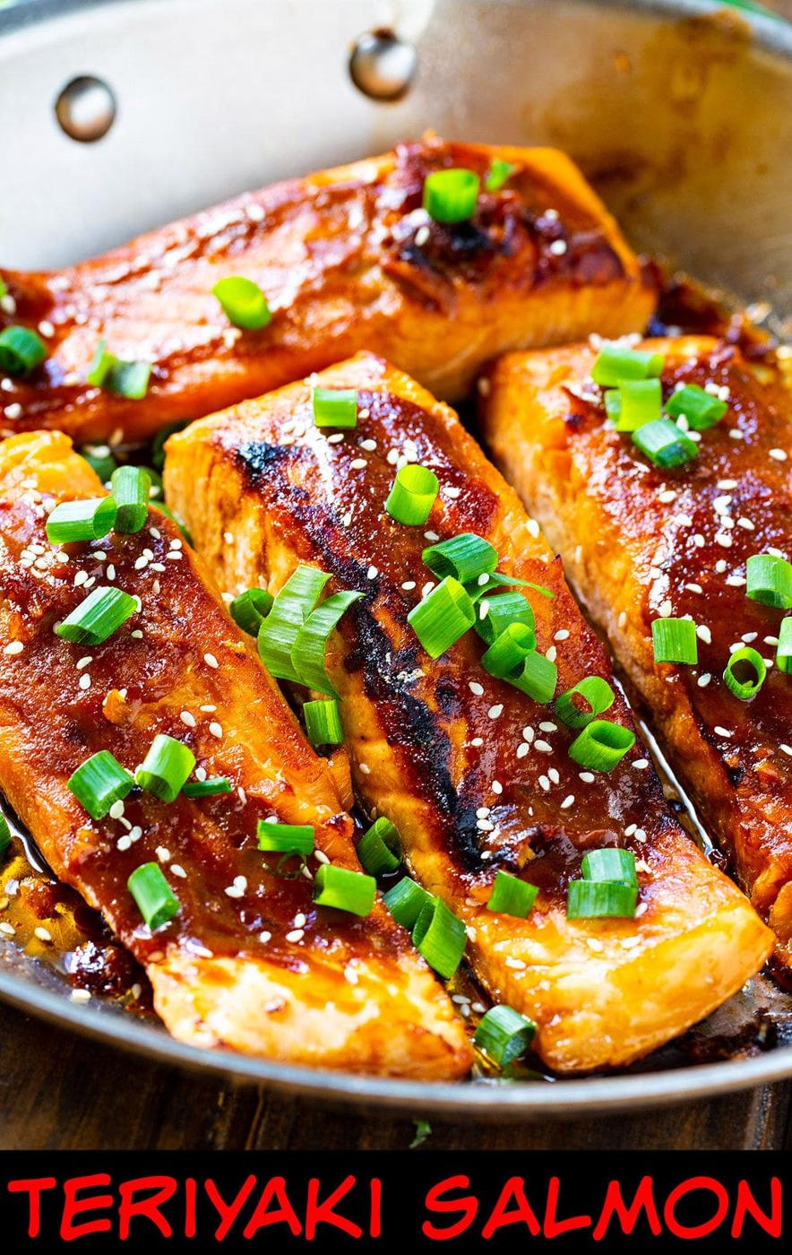 Teriyaki Salmon fillets in a stainless steel pan.